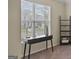 Bright office space featuring a modern desk, natural light, and calming neutral decor at 697 Emporia Loop, Mcdonough, GA 30253