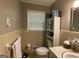 Cozy bathroom with white tiling and vanity at 7111 Indian Creek Sw Cir, Covington, GA 30014