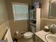 Simple bathroom with classic tiling and natural light at 7111 Indian Creek Sw Cir, Covington, GA 30014