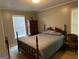 Cozy bedroom with bed and natural light at 7111 Indian Creek Sw Cir, Covington, GA 30014