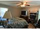 Comfortable bedroom with large bed, dresser, and ample natural light at 7111 Indian Creek Sw Cir, Covington, GA 30014