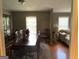 Elegant dining room with large table, chairs, and natural light at 7111 Indian Creek Sw Cir, Covington, GA 30014