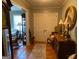 Inviting entryway featuring hardwood floors, a double door entry, and classic furniture at 7111 Indian Creek Sw Cir, Covington, GA 30014
