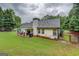 Spacious backyard featuring a covered patio, grill, and play area, perfect for outdoor enjoyment at 160 Laurel Ln, Social Circle, GA 30025