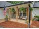 Inviting front porch with stone columns and a cozy seating area for relaxing at 160 Laurel Ln, Social Circle, GA 30025