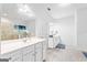 Bright bathroom with double vanity sinks, tile flooring, and well-lit mirrors, perfect for busy mornings at 412 Culloden Moor, Mcdongough, GA 30253