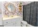 Stylish bathroom with a decorative mirror, patterned shower curtain, and floating shelves at 412 Culloden Moor, Mcdongough, GA 30253