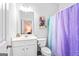 Well-lit bathroom featuring a single vanity, toilet, and bathtub with shower, providing essential amenities at 412 Culloden Moor, Mcdongough, GA 30253