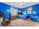 Vibrant bedroom with blue walls, ample décor, and natural light from the window, creating a cozy retreat at 412 Culloden Moor, Mcdongough, GA 30253