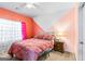 Bright bedroom featuring pink walls, white ceiling fan and large window at 412 Culloden Moor, Mcdongough, GA 30253