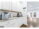 Chic coffee bar with white cabinets, countertop, and a convenient beverage center at 412 Culloden Moor, Mcdongough, GA 30253