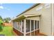This home features a spacious, enclosed porch and well-kept lawn at 412 Culloden Moor, Mcdongough, GA 30253