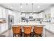 Modern kitchen featuring white cabinets, stainless steel appliances, and a large center island at 412 Culloden Moor, Mcdongough, GA 30253