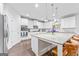 Modern kitchen featuring white cabinets, stainless steel appliances, and a large center island at 412 Culloden Moor, Mcdongough, GA 30253