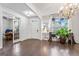 Bright living room with hardwood floors, view into office, chandelier lighting, decorative trim at 412 Culloden Moor, Mcdongough, GA 30253