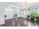 Spacious living room featuring hardwood floors, chandelier lighting, and decorative wall trim at 412 Culloden Moor, Mcdongough, GA 30253