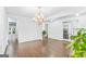 Bright living room with hardwood floors and chandelier lighting, view to other rooms at 412 Culloden Moor, Mcdongough, GA 30253