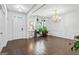 Bright living room featuring hardwood floors, chandelier lighting, and decorative wall trim at 412 Culloden Moor, Mcdongough, GA 30253