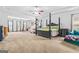 Expansive main bedroom with tray ceiling, ceiling fan, and sitting area with view of the backyard at 412 Culloden Moor, Mcdongough, GA 30253