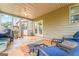 Comfortable screened in porch with ceiling fan, seating, and patio at 412 Culloden Moor, Mcdongough, GA 30253