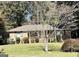 Charming single-story brick home with a well-maintained front yard and mature trees at 984 Morrow Rd, Morrow, GA 30260