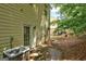 The backyard featuring lush trees and a patio area with a visible air conditioning unit at 4862 Park Cir, Atlanta, GA 30349