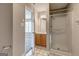 Bathroom with stand-up shower and vanity cabinet with view into bedroom at 4862 Park Cir, Atlanta, GA 30349
