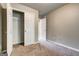 Bedroom features a carpeted floor and a spacious closet for storage at 4862 Park Cir, Atlanta, GA 30349