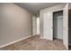 A well-lit bedroom featuring neutral walls, plush carpeting, and a closet for ample storage at 4862 Park Cir, Atlanta, GA 30349