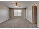 A spacious bedroom with neutral carpet and a ceiling fan and great natural light at 4862 Park Cir, Atlanta, GA 30349