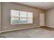 Bright living room featuring large windows, plush carpeting, and neutral paint tones at 4862 Park Cir, Atlanta, GA 30349
