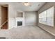 Open living room showcasing a fireplace with a white mantel, carpeted floors, and natural light at 4862 Park Cir, Atlanta, GA 30349