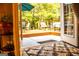View of a deck with outdoor seating and a table at 6830 Peeksville Rd, Mcdonough, GA 30252