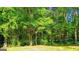 Tree-filled backyard offers plenty of privacy and a natural setting, perfect for outdoor enjoyment at 6830 Peeksville Rd, Mcdonough, GA 30252