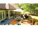 Outdoor deck offering lovely view, complete with dining set and grill for enjoying peaceful outdoor space at 6830 Peeksville Rd, Mcdonough, GA 30252