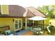Spacious outdoor deck offers an inviting area with comfortable seating and a grill for outdoor gatherings at 6830 Peeksville Rd, Mcdonough, GA 30252