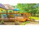 Inviting wooden deck provides ample space for relaxing with comfortable patio furniture and a grill for outdoor cooking at 6830 Peeksville Rd, Mcdonough, GA 30252