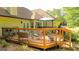Charming backyard deck with seating and grill is a great space for outdoor dining and relaxation at 6830 Peeksville Rd, Mcdonough, GA 30252