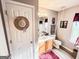 Bright bathroom featuring a vanity, toilet, window, and wood-look flooring at 6830 Peeksville Rd, Mcdonough, GA 30252