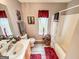 Bathroom with a shower/tub combo, toilet, and wood-look flooring at 6830 Peeksville Rd, Mcdonough, GA 30252