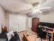 Comfortable bedroom with wood-look flooring, ceiling fan, and a built-in wardrobe at 6830 Peeksville Rd, Mcdonough, GA 30252