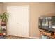 Bedroom view of a closet with bi-fold doors and a window at 6830 Peeksville Rd, Mcdonough, GA 30252