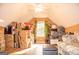 Bright bonus room featuring hardwood floors, natural lighting, and ample storage space at 6830 Peeksville Rd, Mcdonough, GA 30252