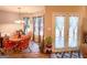 Bright dining area with French doors, providing a seamless connection to the outdoors at 6830 Peeksville Rd, Mcdonough, GA 30252