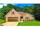 Traditional brick home with a well-maintained lawn, an attached two-car garage, and inviting curb appeal at 6830 Peeksville Rd, Mcdonough, GA 30252