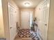 Welcoming foyer showcasing hardwood floors, ample lighting, and a stylish rug at 6830 Peeksville Rd, Mcdonough, GA 30252