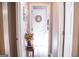 Hallway with art and decor leading to brightly-lit rooms at 6830 Peeksville Rd, Mcdonough, GA 30252