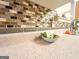 The kitchen has a decorative backsplash and countertops with a view to the sink and faucet at 6830 Peeksville Rd, Mcdonough, GA 30252