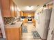 Efficient kitchen with ample cabinetry, modern appliances, and mosaic tile backsplash at 6830 Peeksville Rd, Mcdonough, GA 30252