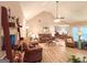 Spacious living room with vaulted ceilings and seamless transition to dining area at 6830 Peeksville Rd, Mcdonough, GA 30252
